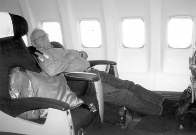 Wayne in a sleeper seat on a Swissair all-business-class flight.