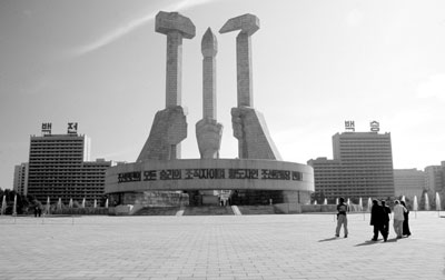 Hammer, sickle and art brush monument marks the spot where the Communist party was formed in North Korea — P’yongyang. 