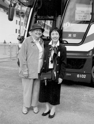 Carolyn Kearns Young with the shore tour guide in Nagasaki, Japan.