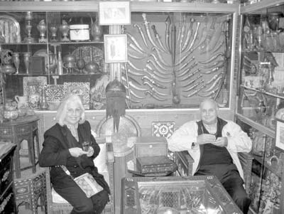 Enjoying tea at the George Dabdoub antique shop.