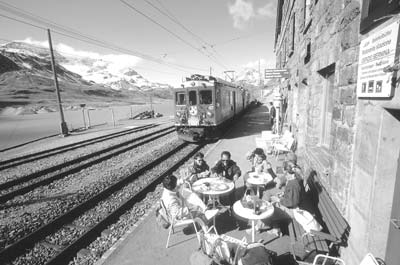 Diners enjoy lunch at Ospizo Bernina (7,403 feet) on the Bernina Pass, where winter lasts seven months. Photo: STS