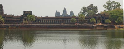 The moat surrounding Angkor Wat, with five towers visible in the distance.