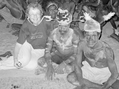 Doris Neilson with Asmat tribesmen in a longhouse — West Papua.