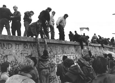 East Germans, West Berliners and West Germans atop the Berlin Wall after the lifting of travel restrictions for East Germans during the night of Nov. 9-10, 1989. Photos courtesy of Landesbildstelle Berlin