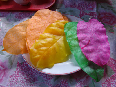 Colorful kiping, having been peeled off their leaf “molds,” are ready to be fashioned into flowers, chandeliers and other decorative items to celebrate the festival of San Isidro Labrador.