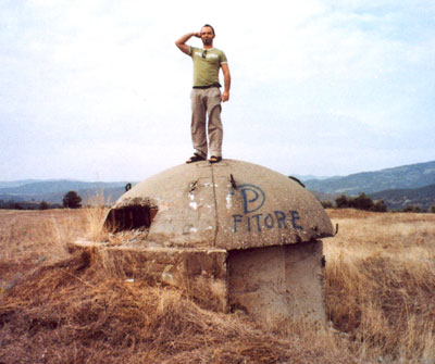 Our local tour guide standing atop an Albanian machine gun nest pillbox.