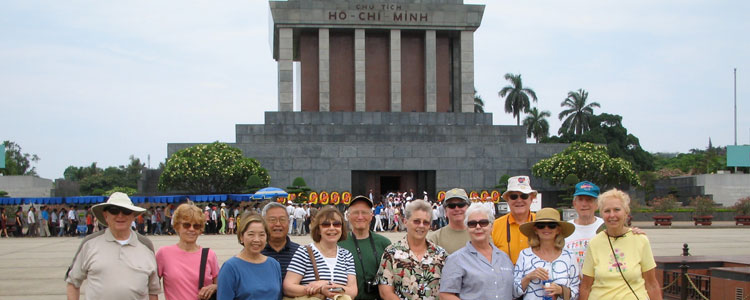 Don and Jean Morris (far left) and their OAT tour group pose in front of the Ho Chi Minh Mausoleum.