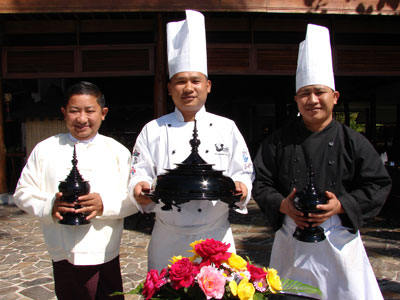Left to right: At the resort, Kyaw Swar Maung Maung (Resident Manager), U Myint Soe (Executive Chef) and U Myo Lwin (Sous Chef) displayed lacquerware serving dishes.