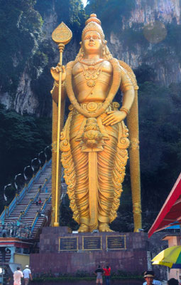 The golden statue of Murugan that stands outside the Batu Caves.