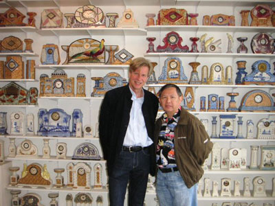 Selliers and visitor Lawrence Peacock in front of a selection of Jacques’ clocks. 