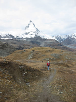 Gloria Gorlin hiking down toward Zermatt from Gornergrat, with the Matterhorn rising in the distance. Photo by Ed Gorlin