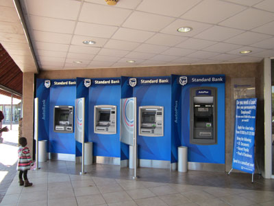 Of these three AutoBank ATMs on the left, we used the second and third machines. We should have used the AutoPlus ATM on the right.  Photos: Steele