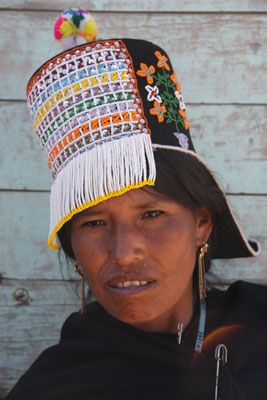 A woman wearing a traditional hat at the Tarabuco Sunday Market in Bolivia. 