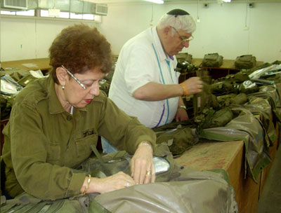 At a medical facility in central Israel, volunteers packed medical supplies in backpacks for the IDF. Photo: Plotkin