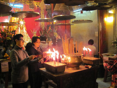 Worshipers make offerings at Tin Hau Temple. Photo by Sharon Cole
