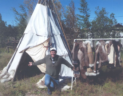 Jim Delmonte outside a teepee with jackets for sale in the first village visited on the Lena River.