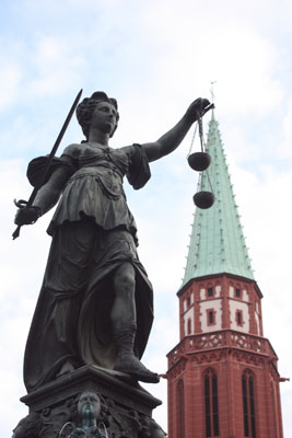 Overlooked by the Alte Nikolai­kirche, the goddess Justitia tops the Gerechtigkeitsbrunnen (Fountain of Justice), built in 1543 in Frankfurt, Germany’s Römerberg square. Photo by Debi Shank, ITN