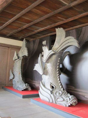 Meant to guard against fire, these 5-foot-tall shachihoko (roof ornaments) each have the head of a dragon and the body of a fish — Osaka Castle Museum.