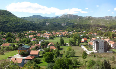 The town of Cetinje, Montenegro, lined by mountains.