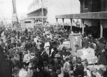 European emigrants crowd a dock in Antwerp, Belgium, before boarding a Red Star Line ship for New York.