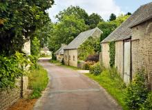 Normandy’s little lanes, cute stone houses, and lush greenery are irresistible. Photo by Dominic Arizona Bonuccelli