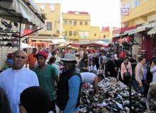 Abdellah (center front, in hat and vest) in Meknes' Sunday market. Photo by Stephen Addison