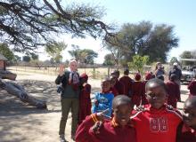 The author with smiling schoolchildren in Mfuwe.