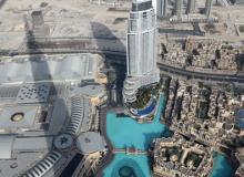View of a man-made lake and the hotel The Address Downtown Dubai from Burj Khalifa in Dubai, UAE.