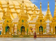 Two young monks walk the grounds of Shwedagon Pagoda in Yangon, the most sacred Buddhist shrine in Myanmar