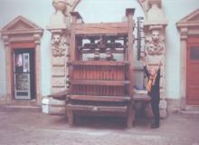 JoAnn Kofoed beside an antique wine press in Beaune. Photo: Bill Kofoed  