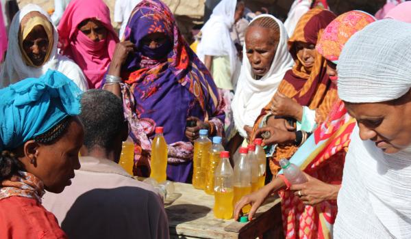At a village market in Eritrea in October 2015, these women were negotiating for cooking oil. Photo by Jeffery L. Carrier