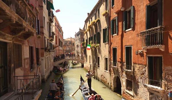 Smart travelers stay oriented, but in scenic cities such as Venice it’s fun to get lost. Photo by Dominic Bonuccelli