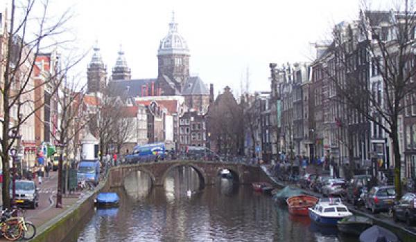 A view of a typical Amsterdam canal looking toward St. Nicholas Church.