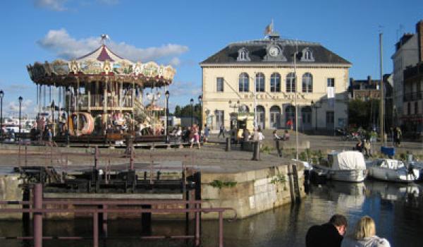 Colorful carousel at Honfleur&rsquo;s old port.