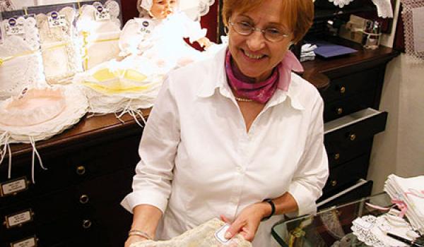 Look for local crafts like intricate Belgian lace when shopping for souvenirs in Europe. Photo: Steves