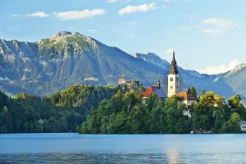 One popular Ljubljana day trip is a visit to Lake Bled, with its iconic church-topped island and ringed by monumental peaks.