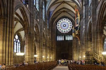 The interior of Strasbourg’s cathedral includes an elaborately carved stone pulpit from the 1400s (lower right) and an exquisite gold-leafed organ (upper right).