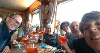 At Rifugio Lagazuoi, Aperol Spritzes are being enjoyed by (from left) Glenn Meade, Bruce Tufts, Julie Felix, Monique Risch Meade, Steve Mullen and Inga Aksamit — the Dolomites, northeastern Italy. Photo by Inga Aksamit