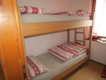A typical dorm room with bunks at Rifugio Sonino al Coldai — the Dolomites, northeastern Italy. Photo by Inga Aksamit
