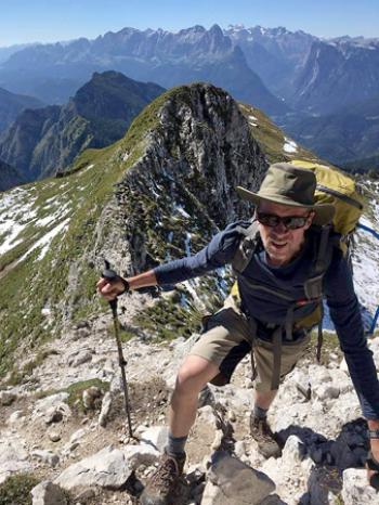 Hiker Glenn Meade near Rifugio Pian de Fontana on a tricky section of ridge. Photo by Monique Risch Meade