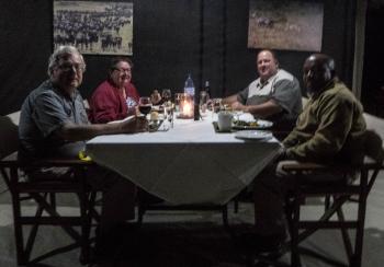Dinner at “Rhino Lodge.” Seated (left to right) are George, Sandra, Pierre and our driver, Goodluck.