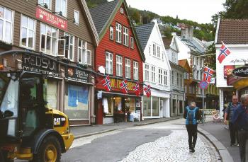 Colorful buildings line a street in Bergen, Norway.