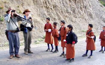 Members of our birding group being observed by Bhutanese schoolchildren. Photo by Linda Beuret