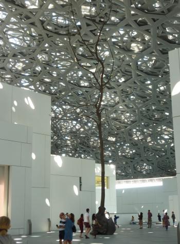 An area outside the galleries of the Louvre Abu Dhabi. The pierced roof filtered the changing light throughout the day, giving it a magical quality.