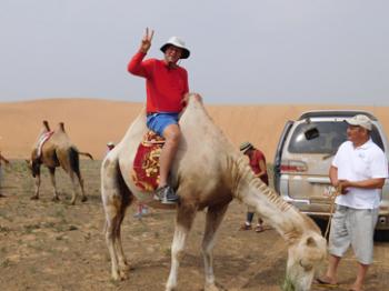 Jim Delmonte on a camel in Mongolia.