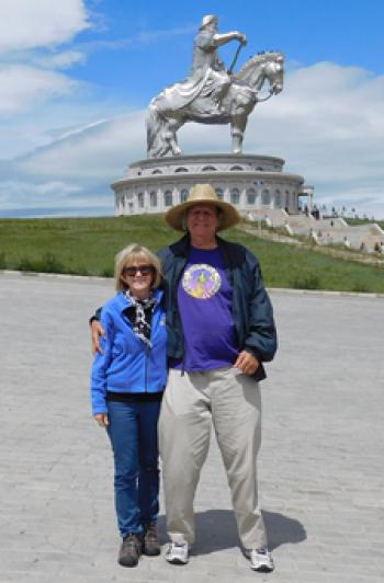 Sandy and Jim Delmonte at the statue of Genghis Khan — Mongolia.