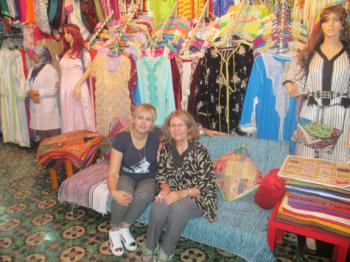Kimberly Edwards (right) and the owner of a dress shop in Fes.