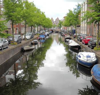 Boats and houses along one of Haarlem's many canals – Netherlands.