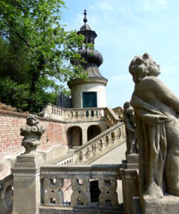 The steps leading to the Bellevue tower, plus a statue along the way, in the Lesser Fürstenberg Garden — Prague.