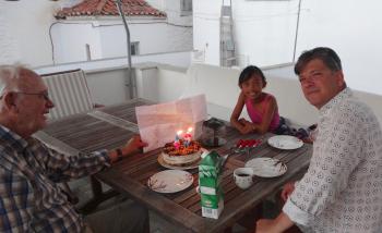 My husband, John, our granddaughter, Cherise, and our son, Will, whose birthday we were celebrating on the upper patio of our apartment in Hydra, with a cake from a local bakery.